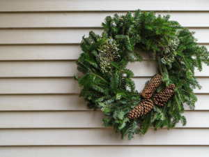 Festive holiday home exterior beautifully decorated by Northern Pacific Roofing, the leading Marin County siding contractor, showcasing vibrant lights and elegant wreaths