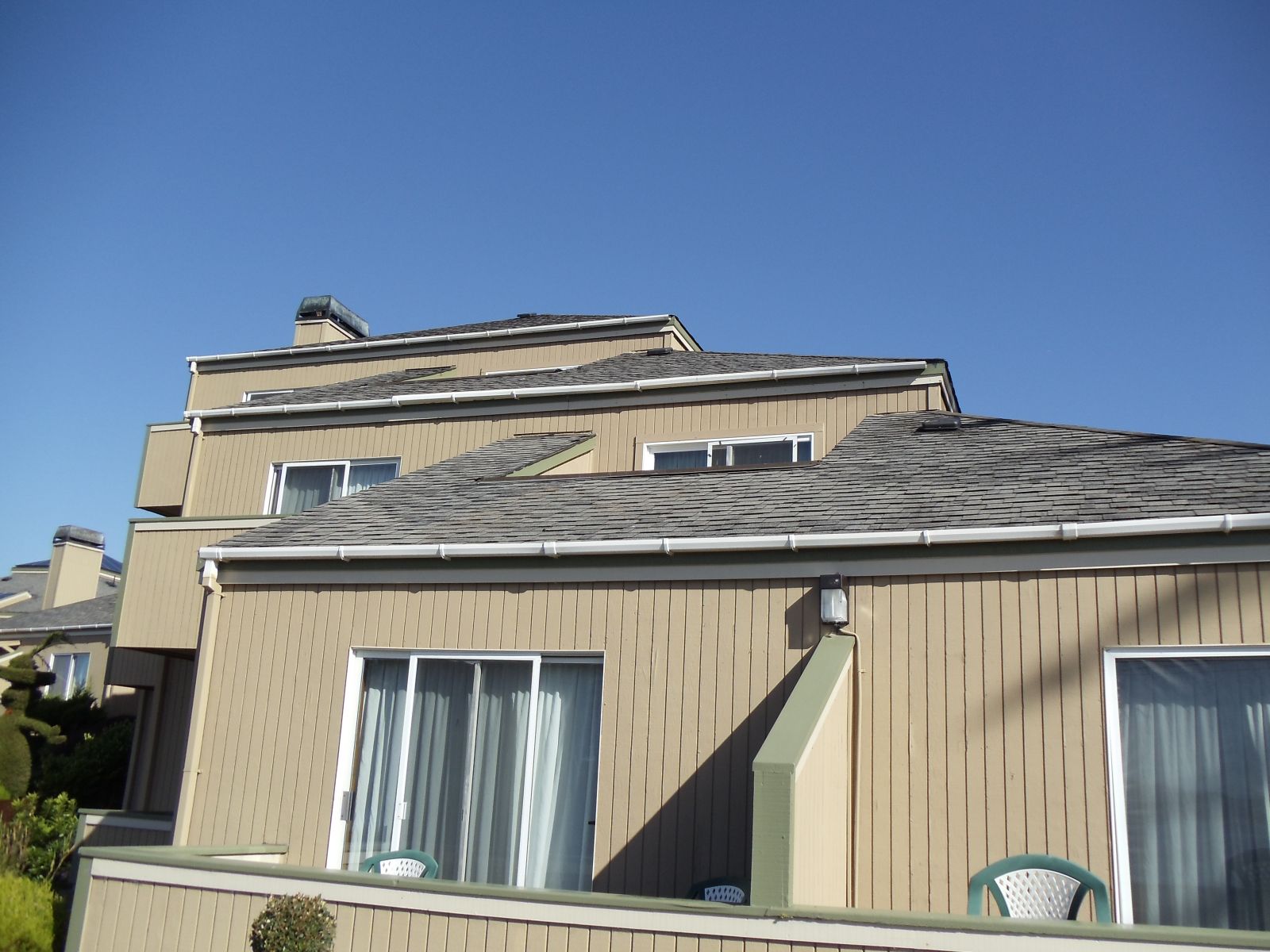 Northern Pacific Roofing team in action, expertly installing holiday lights on home siding, demonstrating top-notch service in Marin County.