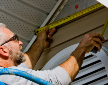 Northern Pacific Roofing team performing siding repairs