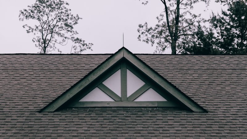 A newly replaced asphalt shingle roof on a home