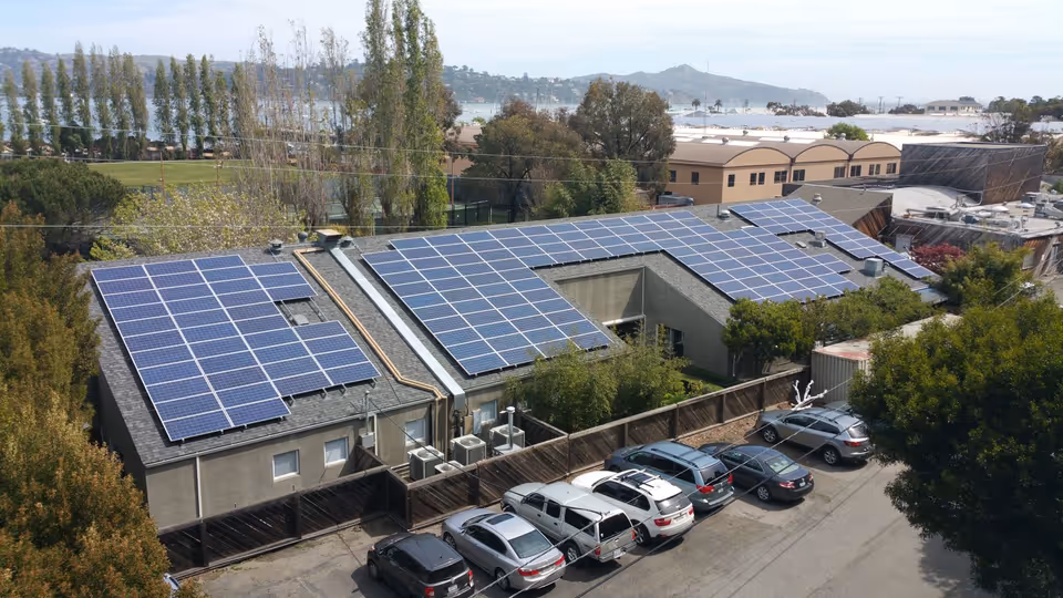 Low-slope commercial roof with rooftop solar array — commercial roofing by Northern Pacific Roofing