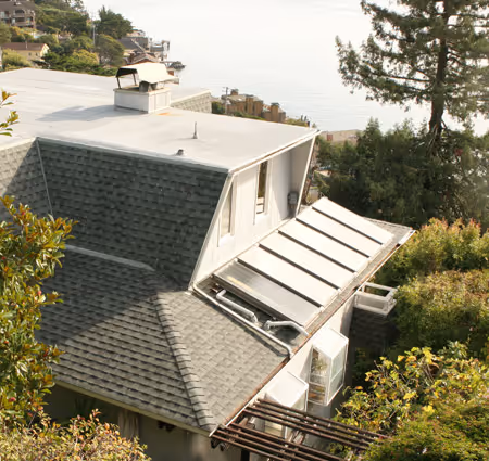 Composition shingle and metal roofing on a hillside home overlooking the bay — Northern Pacific Roofing