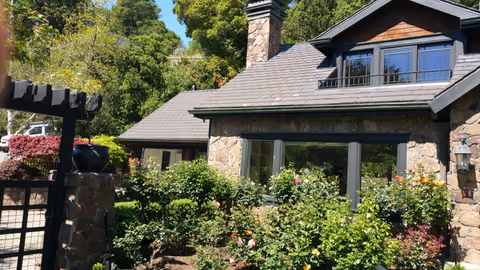 Marin Craftsman home with a new roof and stone chimney by Northern Pacific Roofing
